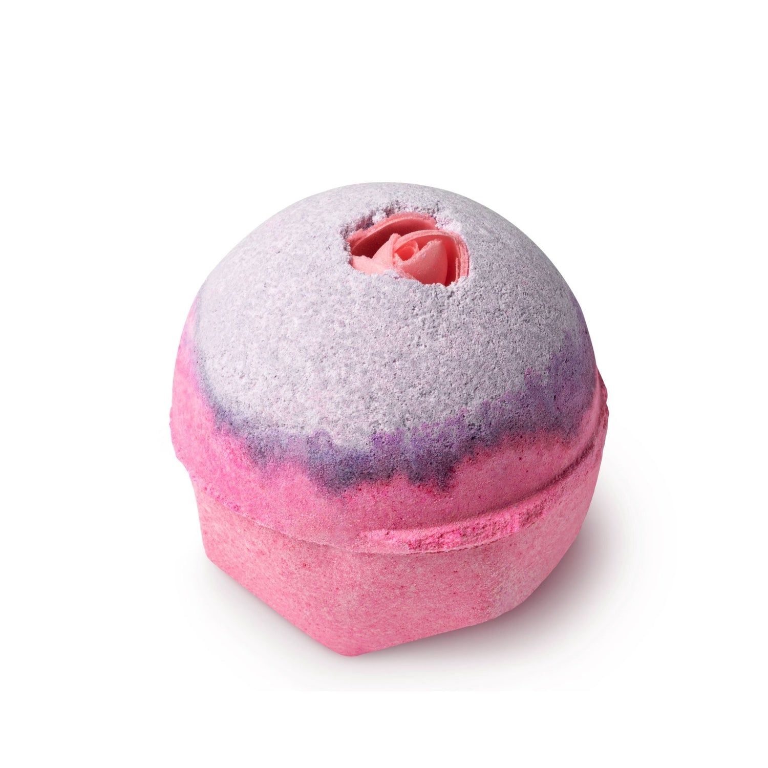 A round pink and purple Lush bath bomb with a flower in the middle.